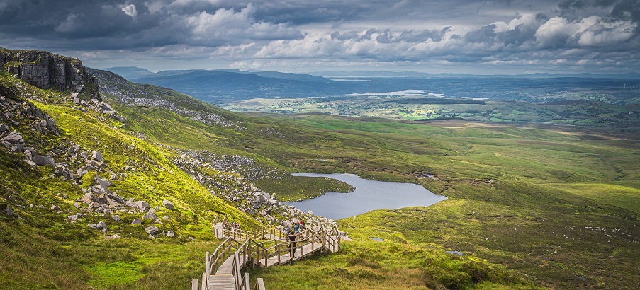 Cuilcagh Mountain Park - View on lake and valley below with dramatic sky, Northern Ireland